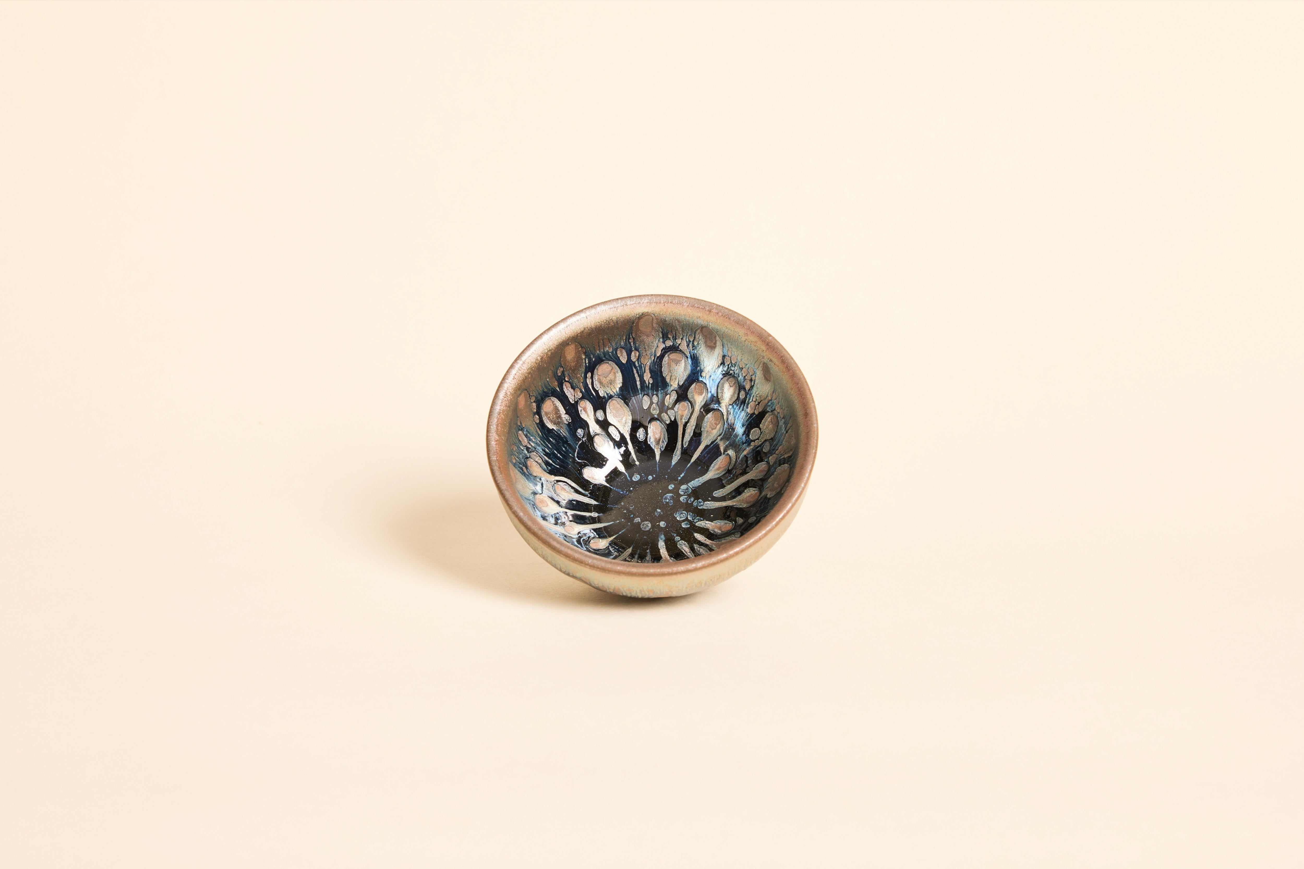 Tadpole Tenmoku bowl with dark gold metallic glaze and speckled pattern