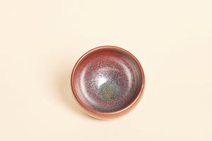Handmade dark red Jian ware tea bowl with smooth ember-like patterns