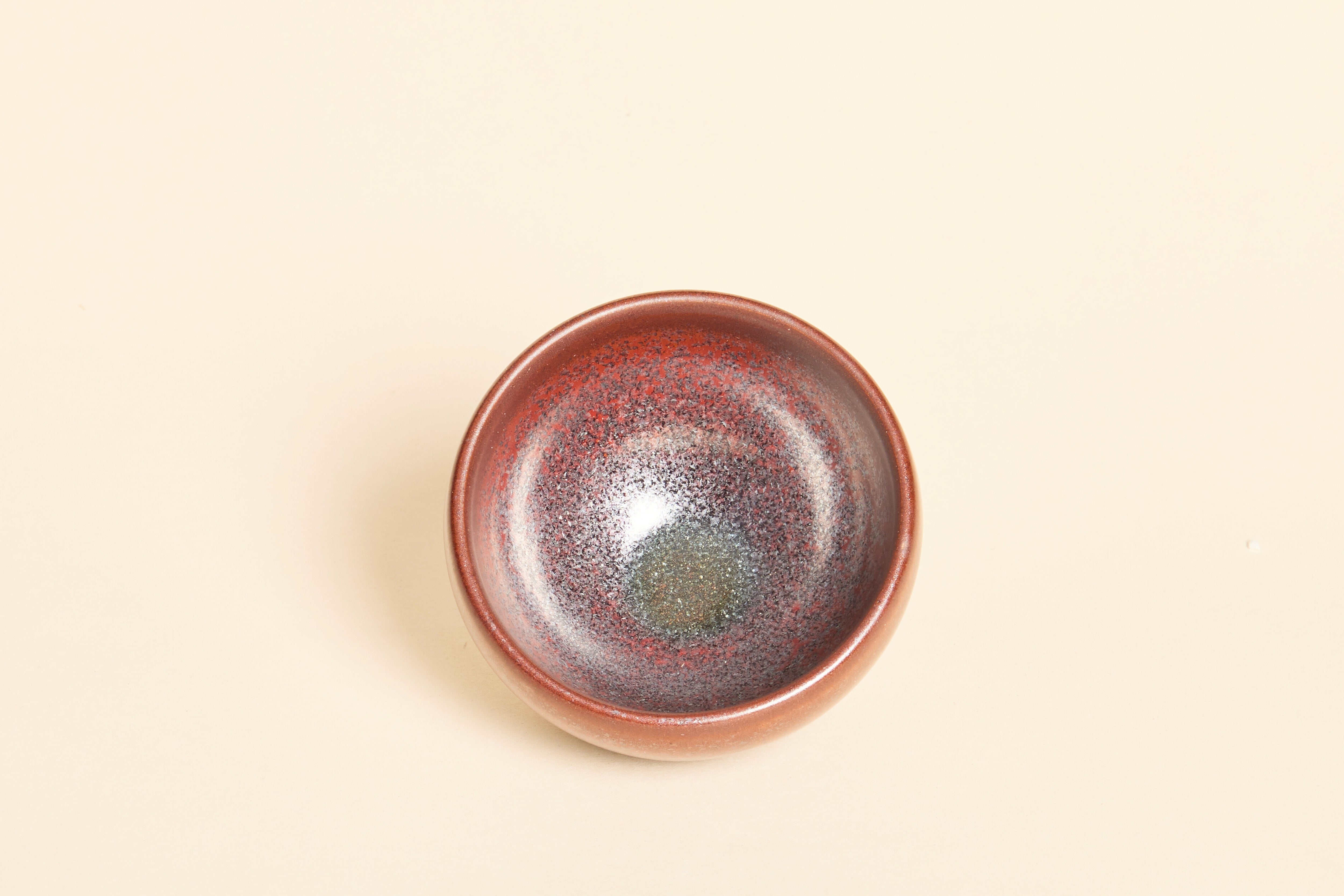 Handmade dark red Jian ware tea bowl with smooth ember-like patterns