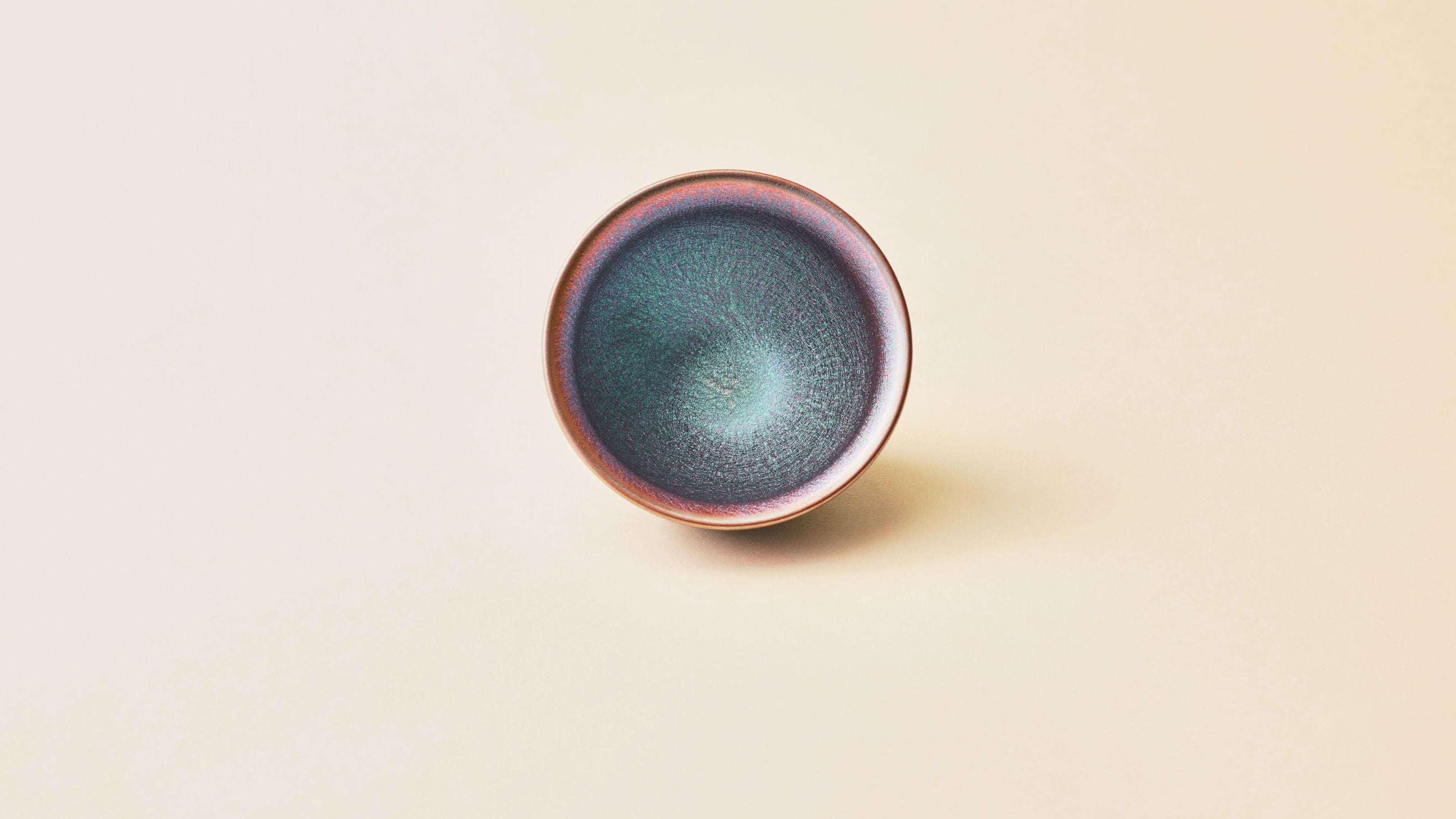Top view of Aurora Tenmoku tea bowl showing iridescent glaze pattern
