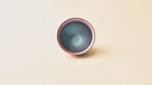 Top view of Aurora Tenmoku tea bowl showing iridescent glaze pattern