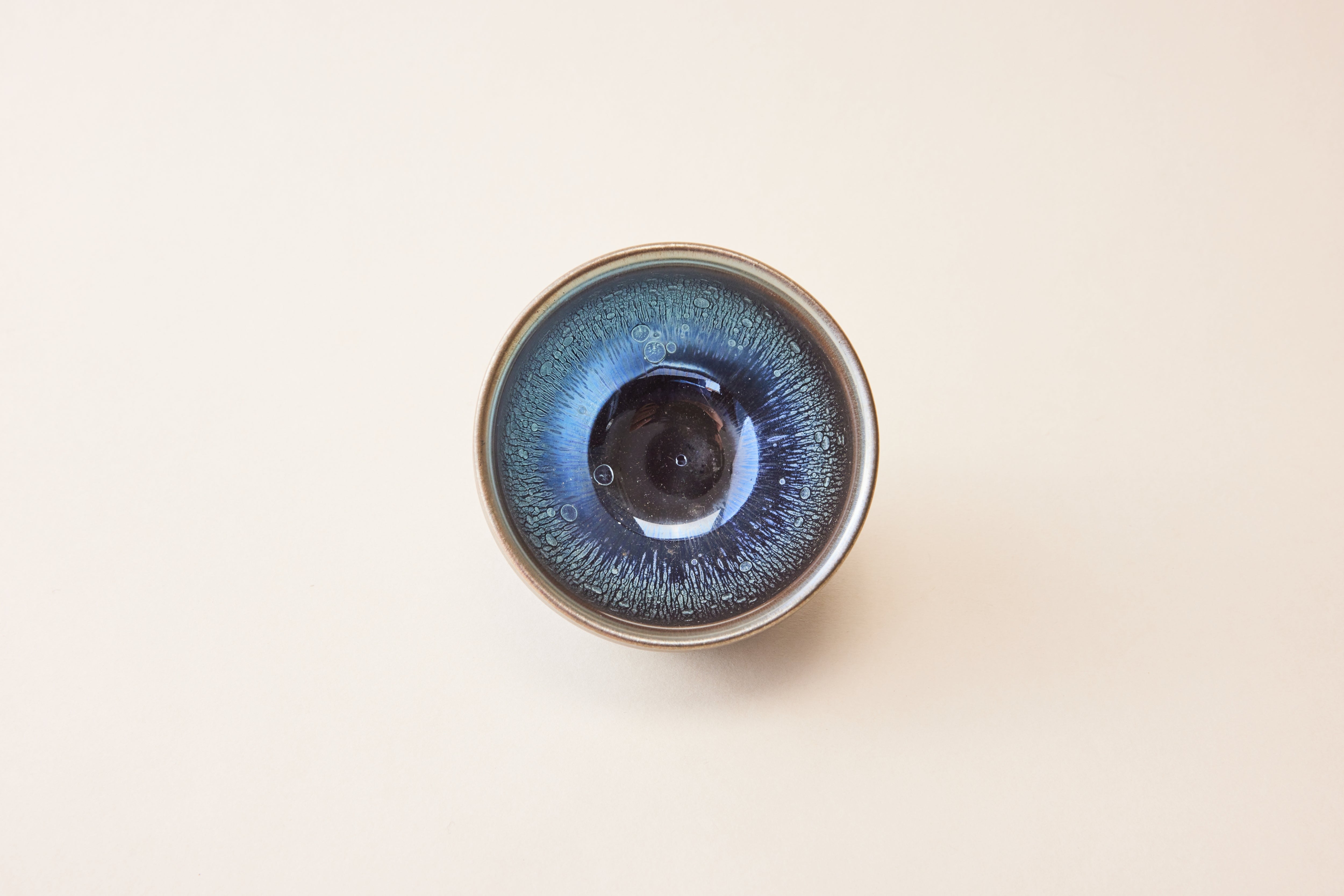 Top view of Stargazer Oilspot tea bowl showing star-like oil spot patterns