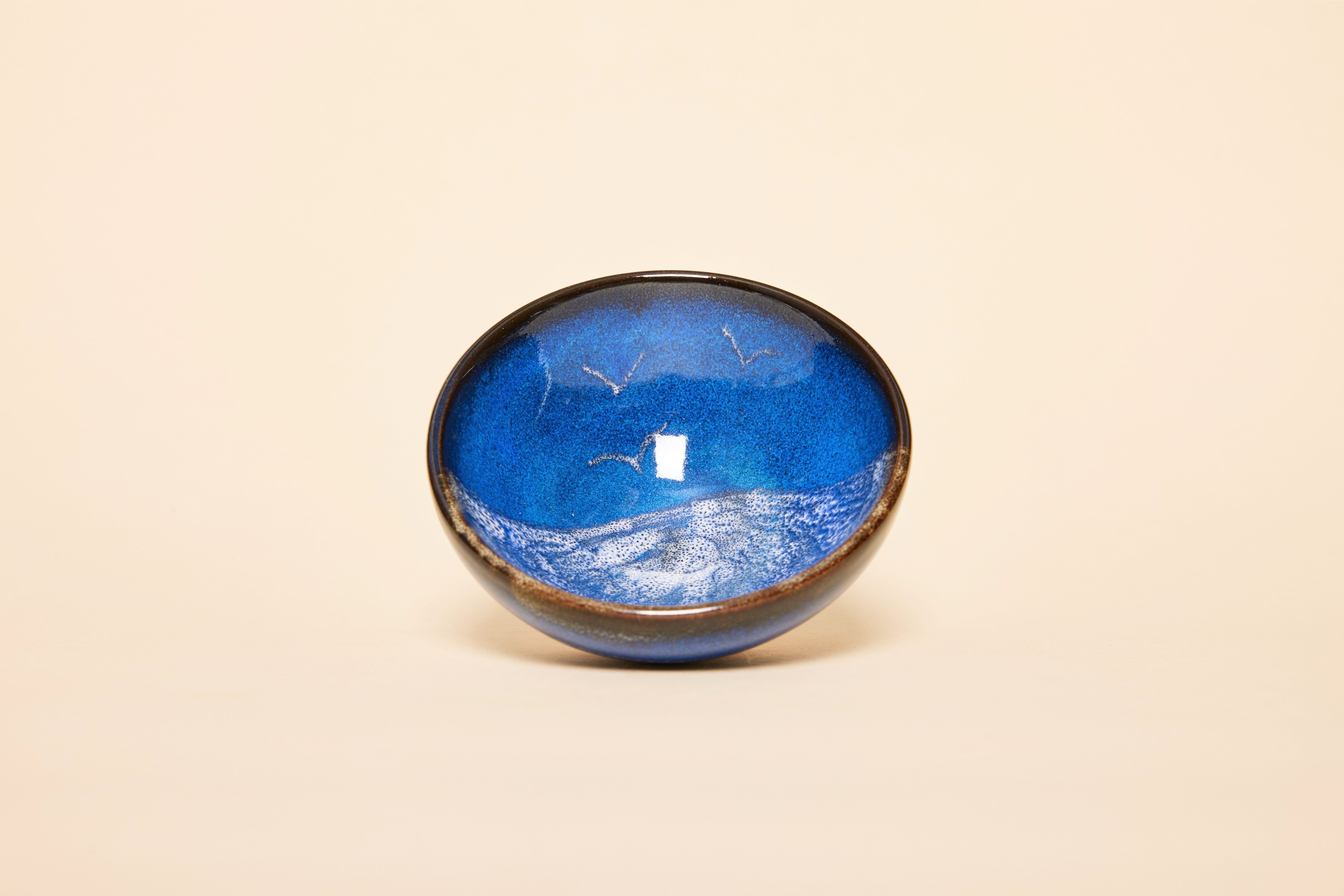 Seagull and mountain motif handmade Jianzhan teacup in Tenmoku style