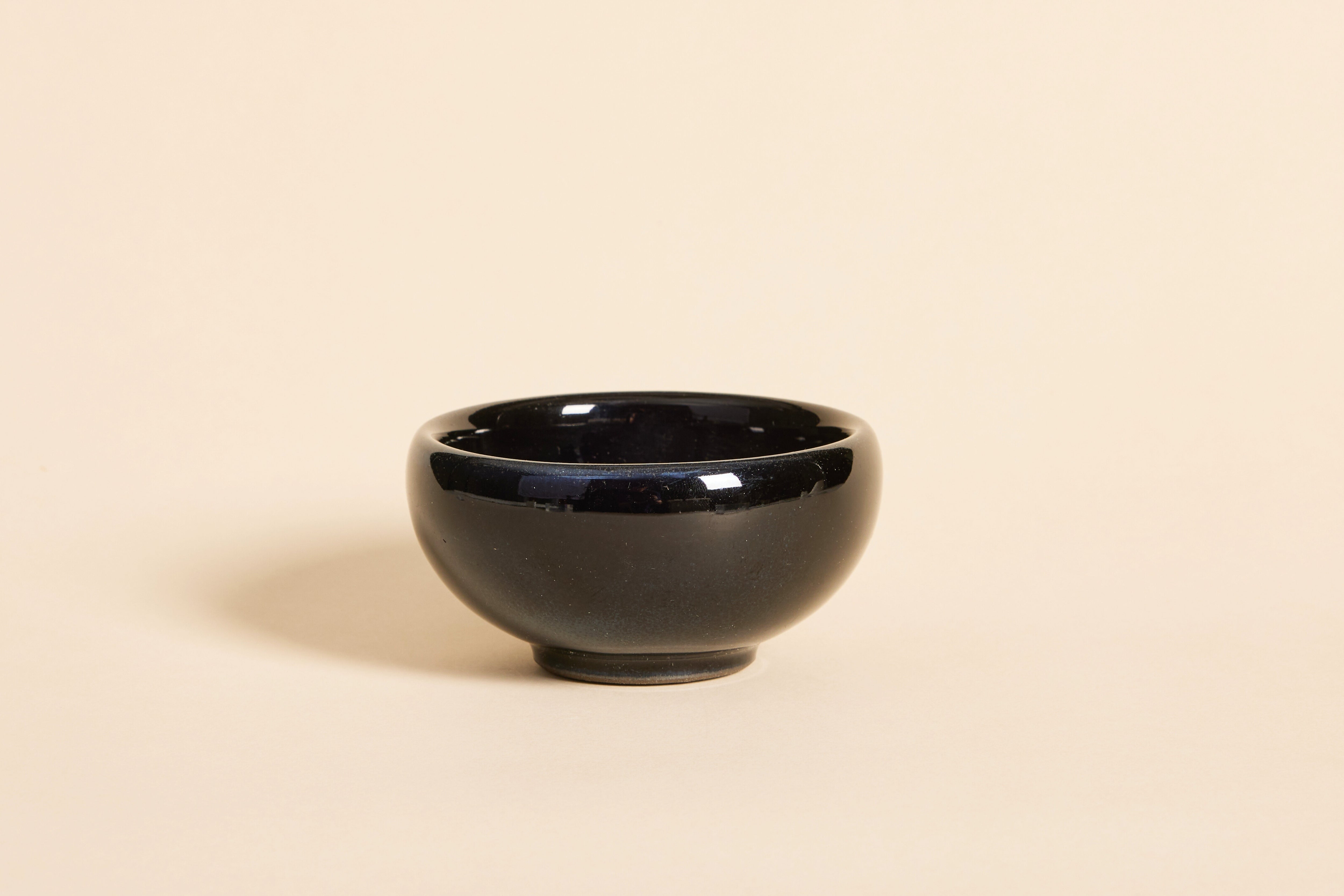 Handmade black Jian ware teacup with subtle gilded highlights